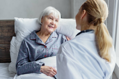 doctor visiting elderly woman